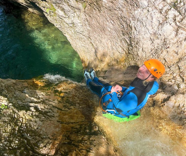 Bovec: Canyoning for Beginners Experience - The final slide into the emerald pool