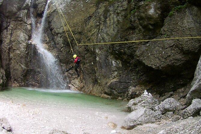 Canyoning In The Triglav National Park - The 50-meter descent beside the waterfall