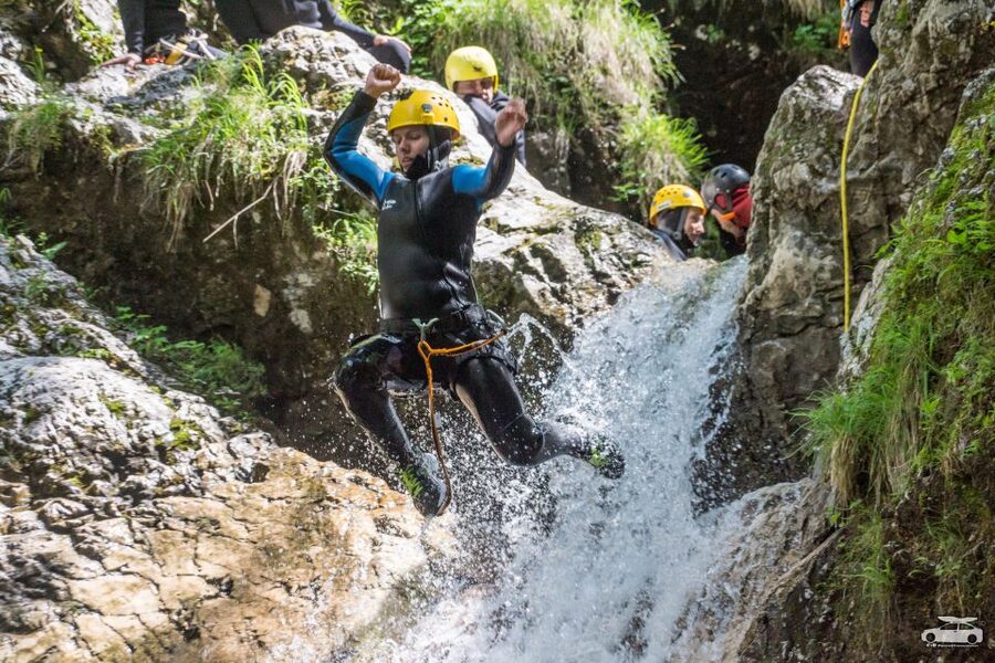 From Bovec: Half-Day Canyoning Tour in Soča Valley - Entering the first emerald pool