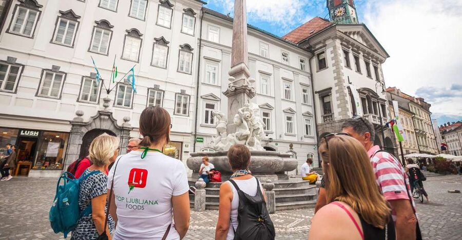 Ljubljana: Slovenian Cuisine Walking Tour with Tastings - Starting beside the Triple Bridge
