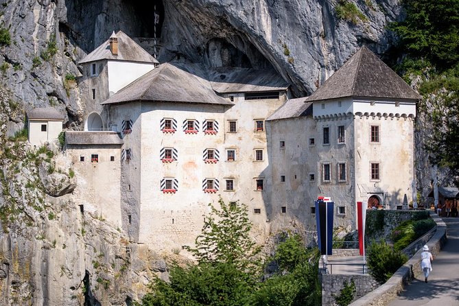 Postojna Cave & Photostop Predjama castle - Group Tour from Koper - Predjama Castle is a striking but brief stop